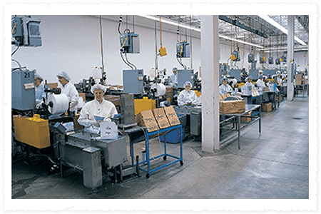 Factory interior with workers in a production line setting