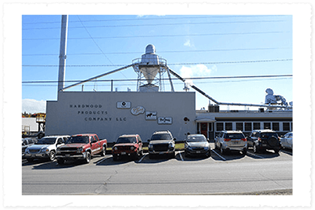 Commercial building with multiple cars parked in front